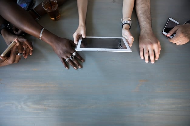 Close-up of a diverse group of people's hands interacting with various digital devices (phone, tablet, laptop), symbolizing connection and personalized digital experiences.