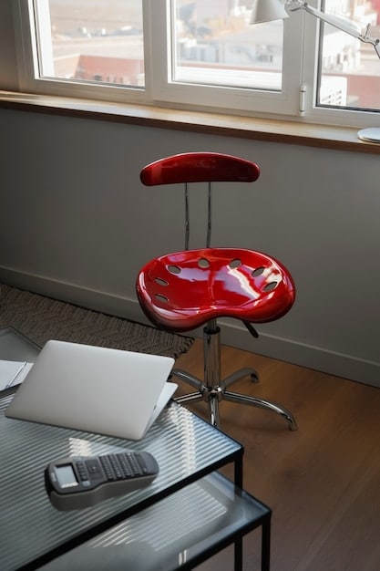 A meticulously organized home office setup with natural light, a minimalist desk, an ergonomic chair, and a high-performance laptop, symbolizing an optimized workspace for productivity.