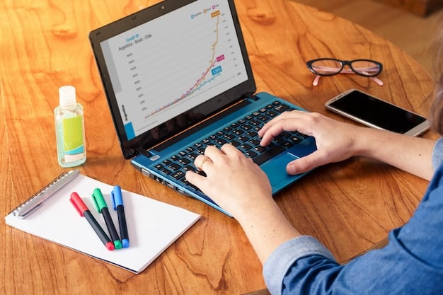 A person's hand typing on a laptop, displaying a screen with various market research charts and graphs, indicating data analysis for niche selection in e-commerce.