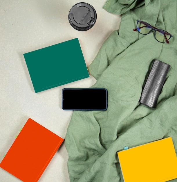 A detailed flat lay of various print-on-demand products like a custom t-shirt, mug, and phone case, neatly arranged around a laptop displaying a supplier's integration page, highlighting product quality and variety.